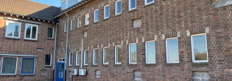 Brick wall with windows and reflections