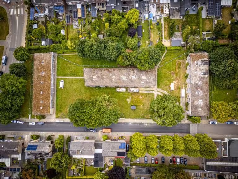 Aerial view of green residential area.